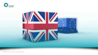 two cubes, one decorated with a UK flag, one with an EU flag.